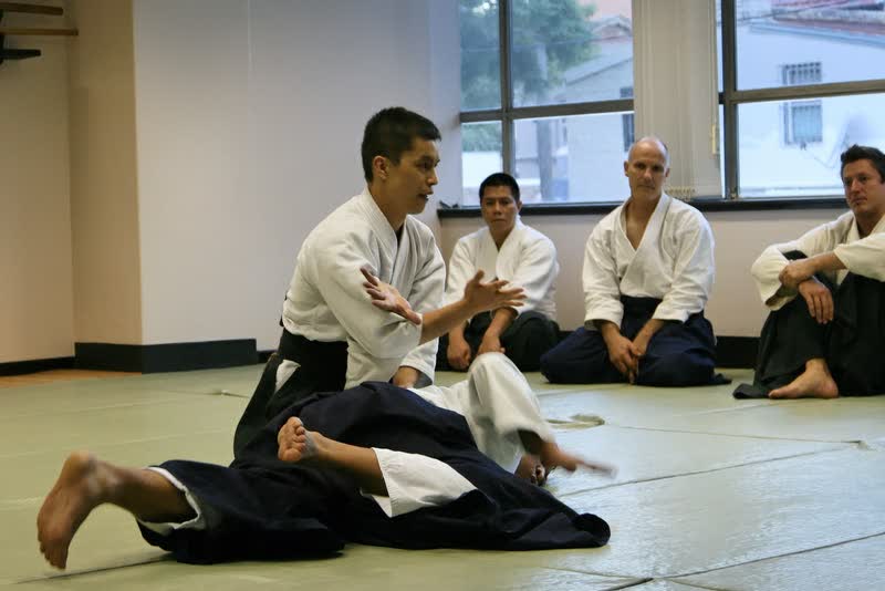 Bruce Choy holding a nikyo pin