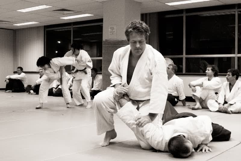 Chris holding a nikyo pin at the Surry Hills dojo