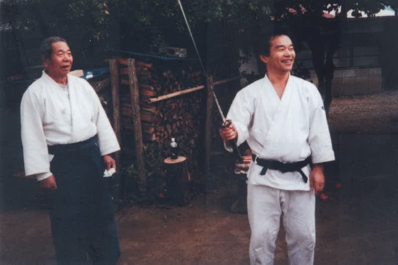 Saito Sensei and Takayasu Sensei outside the dojo at Iwama
