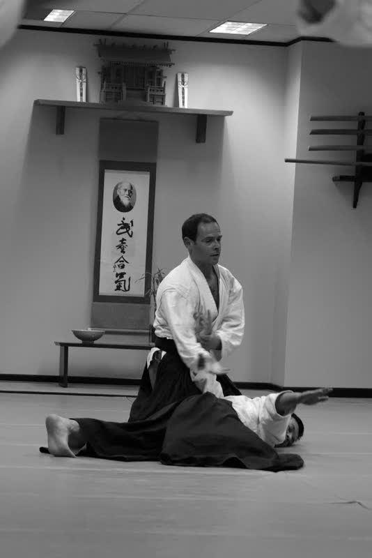 Len Shenfield holding a sankyo pin at the Surry Hills dojo