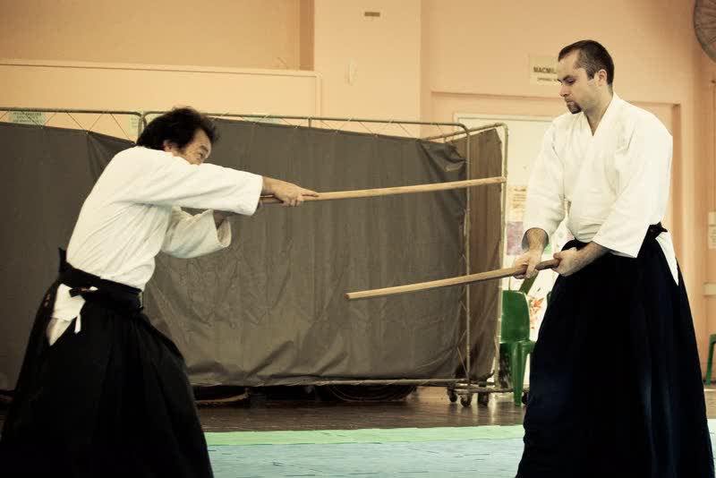 Takayasu Sensei and Adam working kumitachi at a gasshuku at the North Sydney PCYC