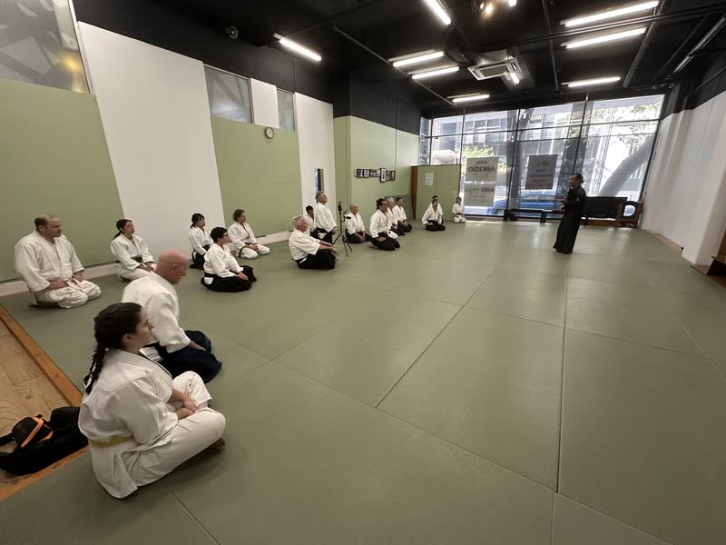 Takayasu Sensei teaching, the class at work on the mat
