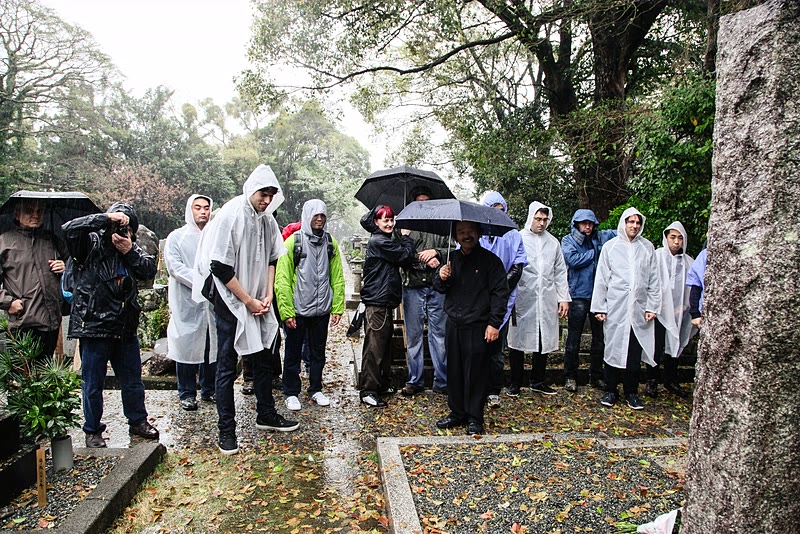 The group in front of O-Sensei's grave and memorial