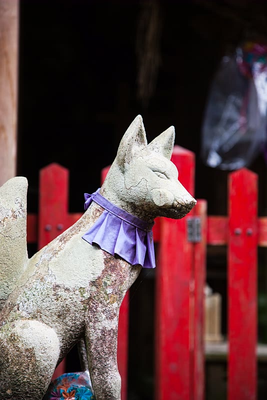 Stone fox (kitsune) next to a shrine along the Kumano Kodo.