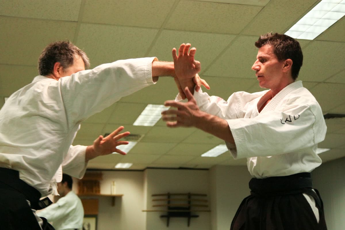 Two students working through a technique